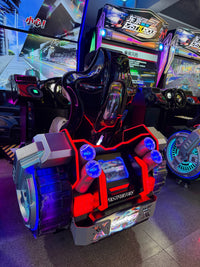 Load image into Gallery viewer, Side view of racing simulator seat and decorative wheel base
